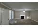 Living room with fireplace, bay window and ceiling fan at 710 Ridge Way, Lithonia, GA 30058