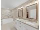 Bathroom boasts double vanity and soaking tub at 116 Carriage Oak Dr, Villa Rica, GA 30180