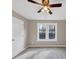 Bedroom with ceiling fan, carpet and large window at 116 Carriage Oak Dr, Villa Rica, GA 30180