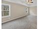 Spacious bedroom with neutral walls and grey carpet at 116 Carriage Oak Dr, Villa Rica, GA 30180