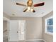 Bedroom with ceiling fan, carpet and access to bathroom at 116 Carriage Oak Dr, Villa Rica, GA 30180