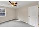 Bright bedroom with ceiling fan and grey carpet at 116 Carriage Oak Dr, Villa Rica, GA 30180