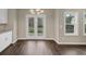 Kitchen dining area with hardwood floors and French doors at 116 Carriage Oak Dr, Villa Rica, GA 30180