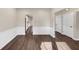 Dining room with dark hardwood floors and white wainscoting at 116 Carriage Oak Dr, Villa Rica, GA 30180