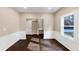 Bright dining room with dark hardwood floors and white wainscoting at 116 Carriage Oak Dr, Villa Rica, GA 30180