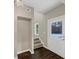 Bright entryway with dark hardwood floors and white door at 116 Carriage Oak Dr, Villa Rica, GA 30180