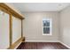 Mudroom with built-in bench and hooks, dark hardwood floors at 116 Carriage Oak Dr, Villa Rica, GA 30180