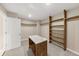 Spacious walk in closet with custom shelving and island at 116 Carriage Oak Dr, Villa Rica, GA 30180