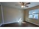 Bright bedroom with dark brown wood flooring and ceiling fan at 2531 Ridgecrest Nw Dr, Kennesaw, GA 30152