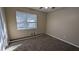 Bright bedroom with neutral walls and carpet flooring, featuring a large window at 2531 Ridgecrest Nw Dr, Kennesaw, GA 30152