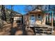 Tan colored shed with wooden steps and chicken coop at 2531 Ridgecrest Nw Dr, Kennesaw, GA 30152