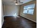 Living room with dark brown wood flooring and ceiling fan at 2531 Ridgecrest Nw Dr, Kennesaw, GA 30152