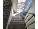 Carpeted staircase with metal railing leading to the front door at 2531 Ridgecrest Nw Dr, Kennesaw, GA 30152