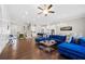 Spacious living room featuring hardwood floors, sectional sofa, and large windows at 3465 Fenton Se Dr, Smyrna, GA 30080