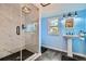 Updated bathroom with a walk-in shower and marble tile at 461 Trabert Nw Ave, Atlanta, GA 30309