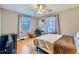 Bright bedroom with a queen bed, hardwood floors and ceiling fan at 461 Trabert Nw Ave, Atlanta, GA 30309