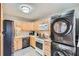 Kitchen with light wood cabinets and modern appliances at 461 Trabert Nw Ave, Atlanta, GA 30309