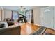 Bright living room features hardwood floors, large windows, and a grand piano at 461 Trabert Nw Ave, Atlanta, GA 30309