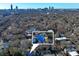 Aerial view of a blue house and city skyline at 991 Greenwood Ne Ave, Atlanta, GA 30306