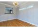 Bright dining room with hardwood floors and kitchen views at 991 Greenwood Ne Ave, Atlanta, GA 30306