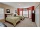 Two twin beds in a spacious bedroom with an accent wall and large windows at 209 Candice Ct, Hampton, GA 30228