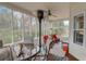 Relaxing screened porch with seating area and outdoor heater at 209 Candice Ct, Hampton, GA 30228