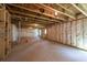 Unfinished basement with insulated walls and exposed ceiling beams, ready for customization and personalization at 311 Willam Gossett Dr, Canton, GA 30114