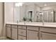 Double vanity bathroom with large mirror and walk-in shower at 455 Duval Dr, Alpharetta, GA 30009