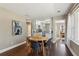 Bright dining room with a wooden table, black chairs, and hardwood floors at 1300 Peachcrest Rd, Decatur, GA 30032