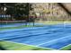 Two well-maintained tennis courts with blue and green surfaces at 190 Country Club Dr, Hiram, GA 30141