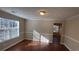 Bright dining room with hardwood floors and wainscoting at 4489 Carriage Park Dr, Lithonia, GA 30038