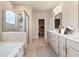Spacious main bathroom with soaking tub and glass enclosed shower at 1446 Auburn Glen Rd, Dacula, GA 30019