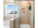 Detailed view of shower stall with tiled walls and glass door at 1446 Auburn Glen Rd, Dacula, GA 30019
