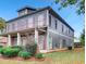 The exterior of this beautiful home features mature landscaping and plenty of yard space at 1520 Vassar Ave, College Park, GA 30337