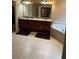 Bathroom featuring double vanity, tile floor, jacuzzi tub, and walk in closet at 1520 Vassar Ave, College Park, GA 30337