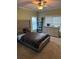 Bedroom featuring a large bed, dresser, and window at 1520 Vassar Ave, College Park, GA 30337