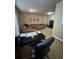 Bonus room with leather sofa, desk, and carpeted floors at 1520 Vassar Ave, College Park, GA 30337