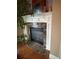 Close up of a fireplace with a marble hearth and white mantle at 1520 Vassar Ave, College Park, GA 30337