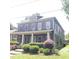 Inviting two-story home boasts a classic design, front porch, and lovely curb appeal at 1520 Vassar Ave, College Park, GA 30337