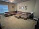 Living room featuring a large leather sofa, carpet, and window at 1520 Vassar Ave, College Park, GA 30337