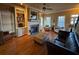 Living room showcasing wood floors, fireplace, built-in shelves, and natural light from the large windows at 1520 Vassar Ave, College Park, GA 30337