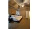 Main bedroom with a tray ceiling, ceiling fan, and en suite bathroom at 1520 Vassar Ave, College Park, GA 30337