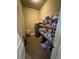 Walk in pantry with storage shelving, and stainless steel refrigerator at 1520 Vassar Ave, College Park, GA 30337