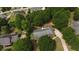 Aerial view showcasing the house's location within a tree-lined neighborhood at 114 Tracy Ln, Mcdonough, GA 30253