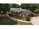 Aerial view of house with brick facade and landscaping at 114 Tracy Ln, Mcdonough, GA 30253