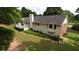 House's back, deck, and surrounding landscape in an aerial view at 114 Tracy Ln, Mcdonough, GA 30253