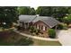 Aerial view of house with brick facade and landscaping at 114 Tracy Ln, Mcdonough, GA 30253