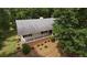 Aerial view of house, deck, and surrounding trees at 114 Tracy Ln, Mcdonough, GA 30253