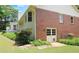 View of home's exterior and backyard with storage building at 114 Tracy Ln, Mcdonough, GA 30253