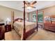 Bright bedroom with a post bed and plenty of space at 114 Tracy Ln, Mcdonough, GA 30253